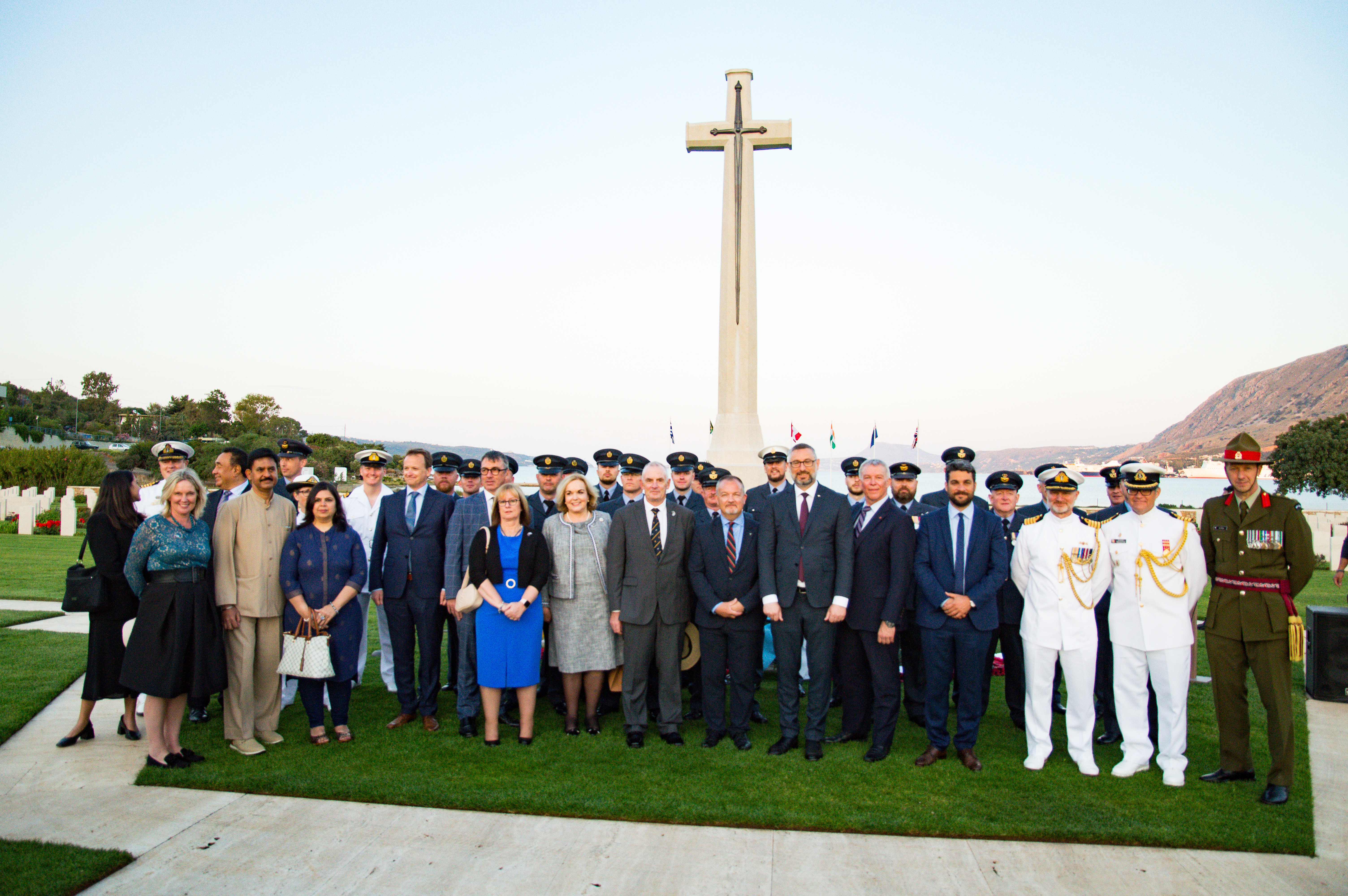 Personnel stand by memorial.